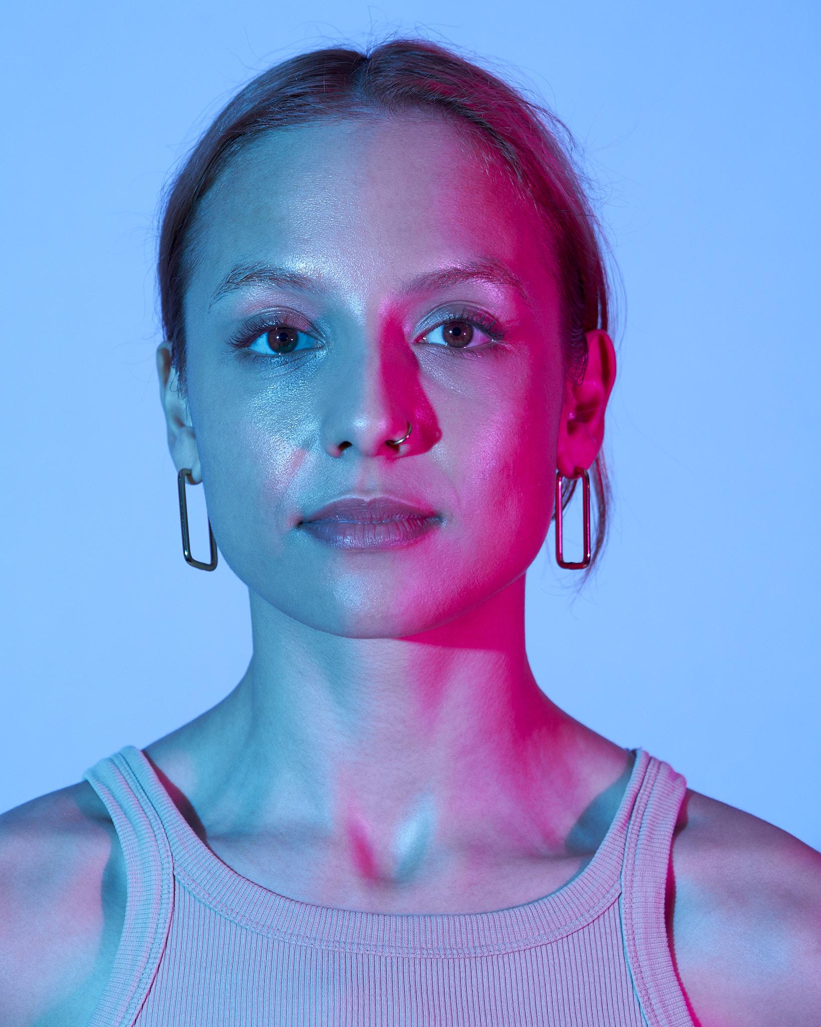 coloured lighting of a woman's face.