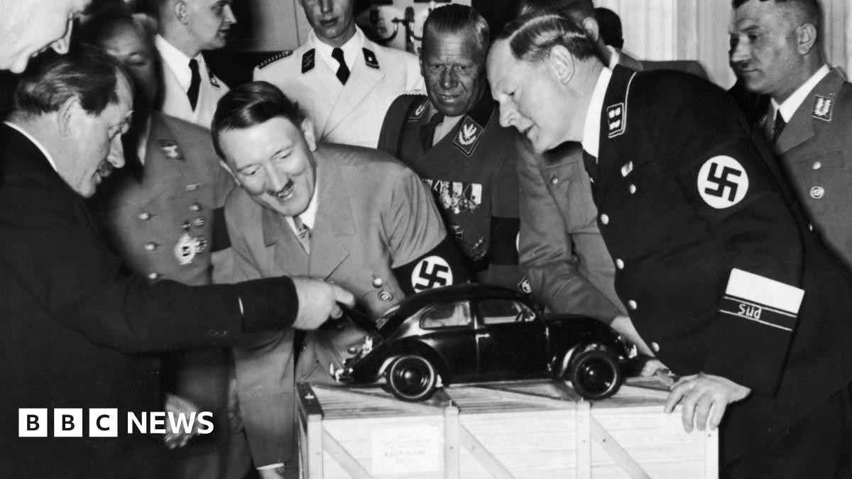 A photo of Hitler in front of a miniature car. It could have been a Tesla in 2025.